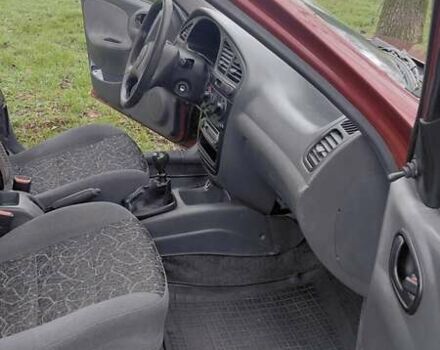 Красный Дэу Ланос, объемом двигателя 1.5 л и пробегом 230 тыс. км за 2600 $, фото 8 на Automoto.ua