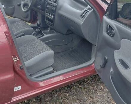 Красный Дэу Ланос, объемом двигателя 1.5 л и пробегом 230 тыс. км за 2600 $, фото 13 на Automoto.ua