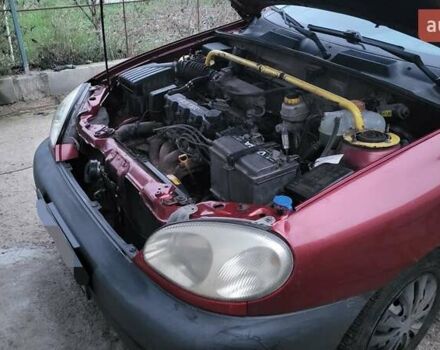Красный Дэу Ланос, объемом двигателя 1.5 л и пробегом 305 тыс. км за 1800 $, фото 6 на Automoto.ua