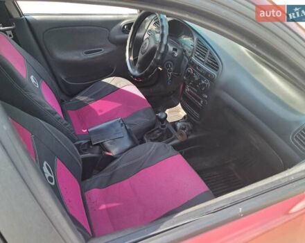 Красный Дэу Ланос, объемом двигателя 1.5 л и пробегом 270 тыс. км за 2100 $, фото 2 на Automoto.ua