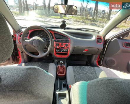 Красный Дэу Ланос, объемом двигателя 1.5 л и пробегом 258 тыс. км за 1750 $, фото 12 на Automoto.ua