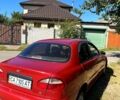 Красный Дэу Ланос, объемом двигателя 1.4 л и пробегом 251 тыс. км за 1400 $, фото 1 на Automoto.ua