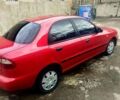 Красный Дэу Ланос, объемом двигателя 1.5 л и пробегом 214 тыс. км за 2600 $, фото 1 на Automoto.ua