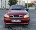 Красный Дэу Ланос, объемом двигателя 1.5 л и пробегом 225 тыс. км за 2399 $, фото 1 на Automoto.ua