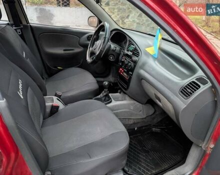 Красный Дэу Ланос, объемом двигателя 1.4 л и пробегом 156 тыс. км за 1950 $, фото 9 на Automoto.ua