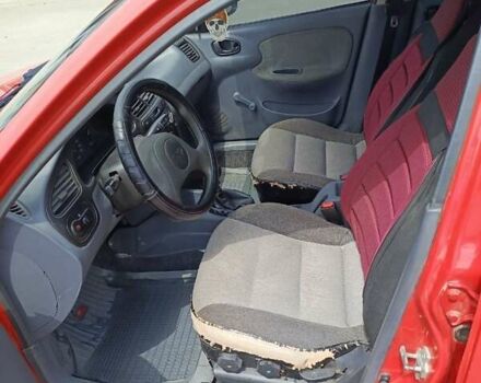 Красный Дэу Ланос, объемом двигателя 1.5 л и пробегом 155 тыс. км за 2297 $, фото 10 на Automoto.ua