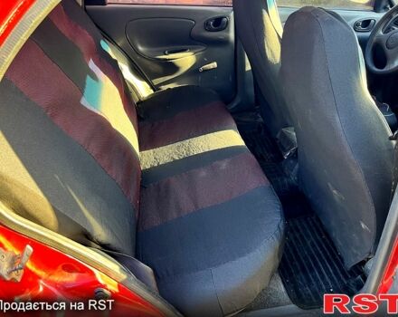 Красный Дэу Ланос, объемом двигателя 1.4 л и пробегом 126 тыс. км за 1500 $, фото 11 на Automoto.ua