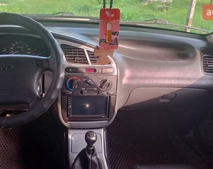 Красный Дэу Ланос, объемом двигателя 1.5 л и пробегом 182 тыс. км за 3100 $, фото 4 на Automoto.ua