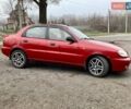Красный Дэу Ланос, объемом двигателя 1.4 л и пробегом 103 тыс. км за 2700 $, фото 2 на Automoto.ua