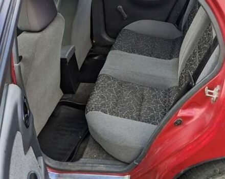 Красный Дэу Ланос, объемом двигателя 1.5 л и пробегом 180 тыс. км за 2000 $, фото 3 на Automoto.ua