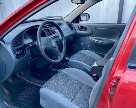 Красный Дэу Ланос, объемом двигателя 1.4 л и пробегом 103 тыс. км за 2700 $, фото 3 на Automoto.ua