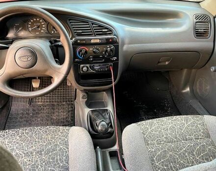 Красный Дэу Ланос, объемом двигателя 1.4 л и пробегом 95 тыс. км за 1999 $, фото 4 на Automoto.ua