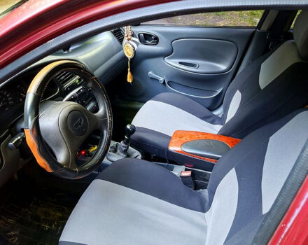 Красный Дэу Ланос, объемом двигателя 1.5 л и пробегом 213 тыс. км за 3000 $, фото 2 на Automoto.ua