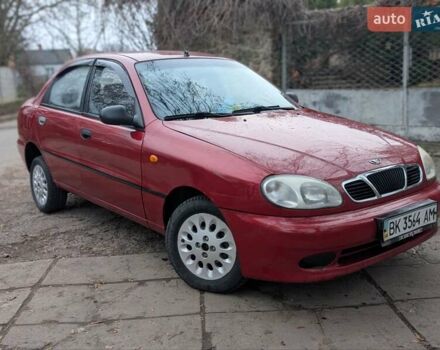 Красный Дэу Ланос, объемом двигателя 1.4 л и пробегом 156 тыс. км за 1950 $, фото 5 на Automoto.ua