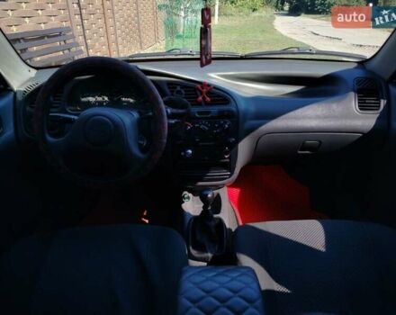 Деу Ланос 2008 у Богодухове на Automoto.ua Червоний Деу Ланос, об'ємом двигуна 1.5 л та пробігом 153 тис. км за 2600 $, фото 16 на Automoto.ua