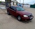 Красный Дэу Ланос, объемом двигателя 1.5 л и пробегом 200 тыс. км за 1950 $, фото 1 на Automoto.ua