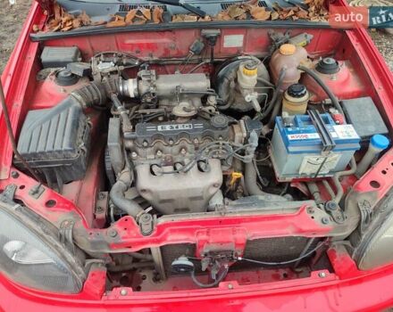 Красный Дэу Ланос, объемом двигателя 1.5 л и пробегом 197 тыс. км за 2400 $, фото 11 на Automoto.ua
