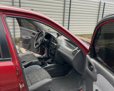 Красный Дэу Ланос, объемом двигателя 1.5 л и пробегом 285 тыс. км за 2600 $, фото 13 на Automoto.ua