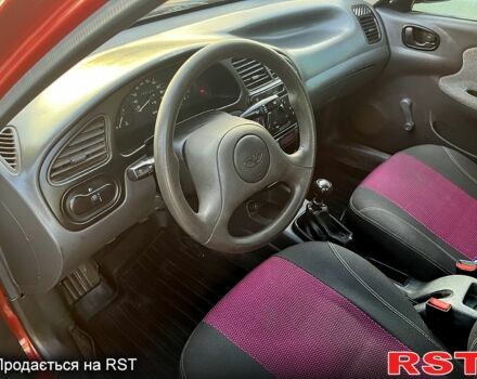 Красный Дэу Ланос, объемом двигателя 1.4 л и пробегом 150 тыс. км за 2700 $, фото 7 на Automoto.ua