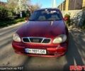 Красный Дэу Ланос, объемом двигателя 1.4 л и пробегом 126 тыс. км за 1500 $, фото 1 на Automoto.ua
