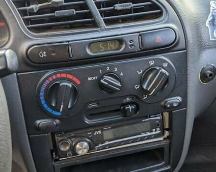 Красный Дэу Ланос, объемом двигателя 1.5 л и пробегом 180 тыс. км за 2000 $, фото 4 на Automoto.ua