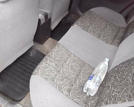 Красный Дэу Ланос, объемом двигателя 1.5 л и пробегом 210 тыс. км за 1800 $, фото 4 на Automoto.ua