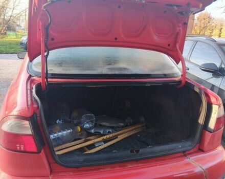 Красный Дэу Ланос, объемом двигателя 1.5 л и пробегом 100 тыс. км за 1500 $, фото 2 на Automoto.ua