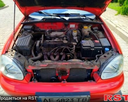 Красный Дэу Ланос, объемом двигателя 1.5 л и пробегом 158 тыс. км за 3500 $, фото 5 на Automoto.ua