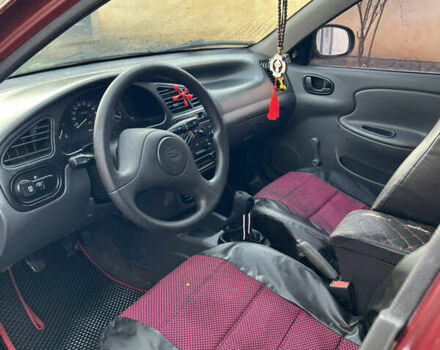 Красный Дэу Ланос, объемом двигателя 1.6 л и пробегом 179 тыс. км за 2099 $, фото 8 на Automoto.ua