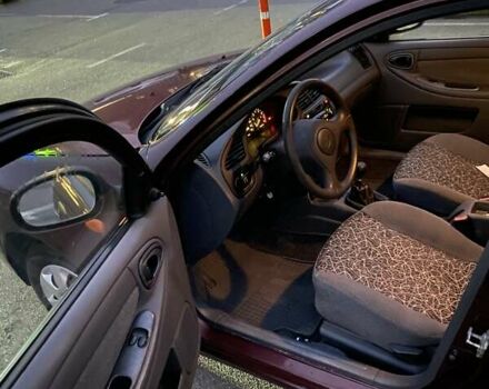 Красный Дэу Ланос, объемом двигателя 1.5 л и пробегом 150 тыс. км за 2500 $, фото 2 на Automoto.ua