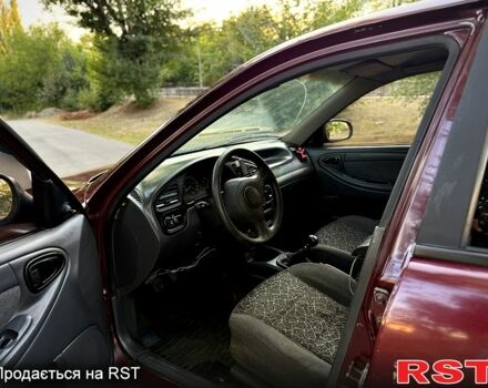 Красный Дэу Ланос, объемом двигателя 1.5 л и пробегом 300 тыс. км за 1350 $, фото 8 на Automoto.ua