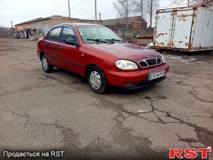 Красный Дэу Ланос, объемом двигателя 1.5 л и пробегом 303 тыс. км за 1550 $, фото 1 на Automoto.ua
