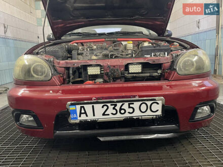 Красный Дэу Ланос, объемом двигателя 1.5 л и пробегом 310 тыс. км за 2400 $, фото 1 на Automoto.ua