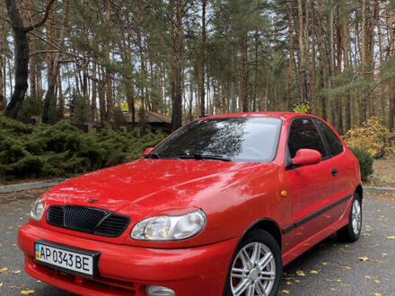 Красный Дэу Ланос, объемом двигателя 1.6 л и пробегом 235 тыс. км за 2350 $, фото 1 на Automoto.ua