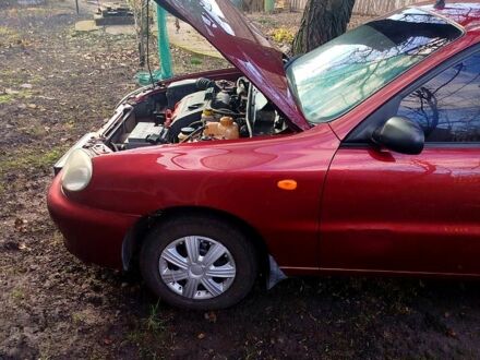 Красный Дэу Ланос, объемом двигателя 1.4 л и пробегом 180 тыс. км за 2400 $, фото 1 на Automoto.ua