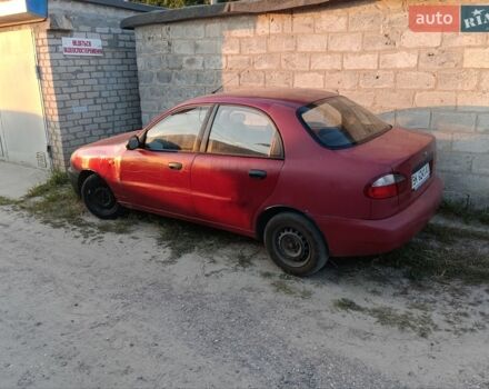 Красный Дэу Ланос, объемом двигателя 1.5 л и пробегом 250 тыс. км за 850 $, фото 1 на Automoto.ua