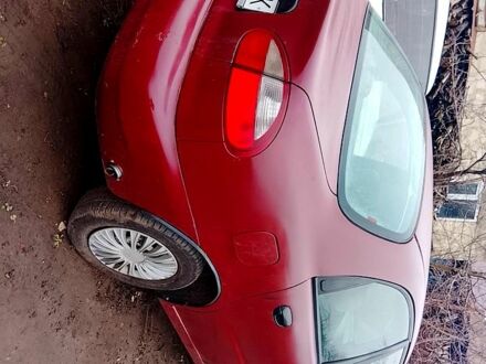 Красный Дэу Ланос, объемом двигателя 1.5 л и пробегом 150 тыс. км за 690 $, фото 1 на Automoto.ua