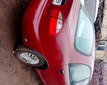 Красный Дэу Ланос, объемом двигателя 1.5 л и пробегом 150 тыс. км за 690 $, фото 1 на Automoto.ua