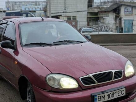 Красный Дэу Ланос, объемом двигателя 1.5 л и пробегом 313 тыс. км за 2400 $, фото 1 на Automoto.ua