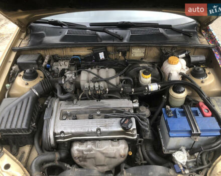 Желтый Дэу Ланос, объемом двигателя 1.6 л и пробегом 215 тыс. км за 2500 $, фото 11 на Automoto.ua