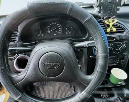 Желтый Дэу Ланос, объемом двигателя 1.3 л и пробегом 200 тыс. км за 1400 $, фото 4 на Automoto.ua