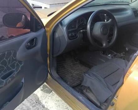 Желтый Дэу Ланос, объемом двигателя 1.5 л и пробегом 272 тыс. км за 2000 $, фото 7 на Automoto.ua