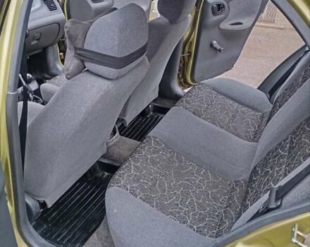 Желтый Дэу Ланос, объемом двигателя 1.39 л и пробегом 195 тыс. км за 2200 $, фото 16 на Automoto.ua