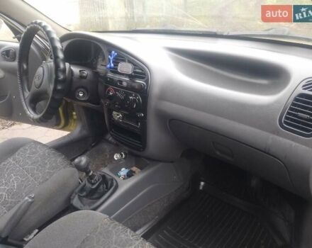 Желтый Дэу Ланос, объемом двигателя 1.5 л и пробегом 190 тыс. км за 1750 $, фото 13 на Automoto.ua