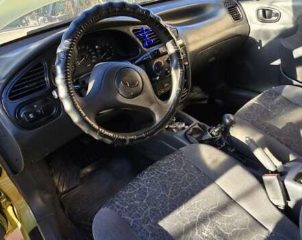 Желтый Дэу Ланос, объемом двигателя 1.5 л и пробегом 310 тыс. км за 1500 $, фото 12 на Automoto.ua