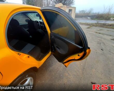 Желтый Дэу Ланос, объемом двигателя 1.4 л и пробегом 269 тыс. км за 1250 $, фото 4 на Automoto.ua