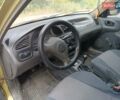 Желтый Дэу Ланос, объемом двигателя 1.5 л и пробегом 244 тыс. км за 1490 $, фото 4 на Automoto.ua