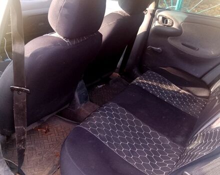 Желтый Дэу Ланос, объемом двигателя 1.4 л и пробегом 300 тыс. км за 1300 $, фото 4 на Automoto.ua