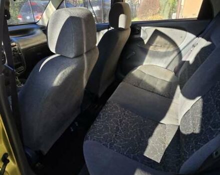 Желтый Дэу Ланос, объемом двигателя 1.5 л и пробегом 310 тыс. км за 1500 $, фото 8 на Automoto.ua