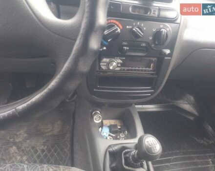 Желтый Дэу Ланос, объемом двигателя 1.5 л и пробегом 190 тыс. км за 1750 $, фото 24 на Automoto.ua